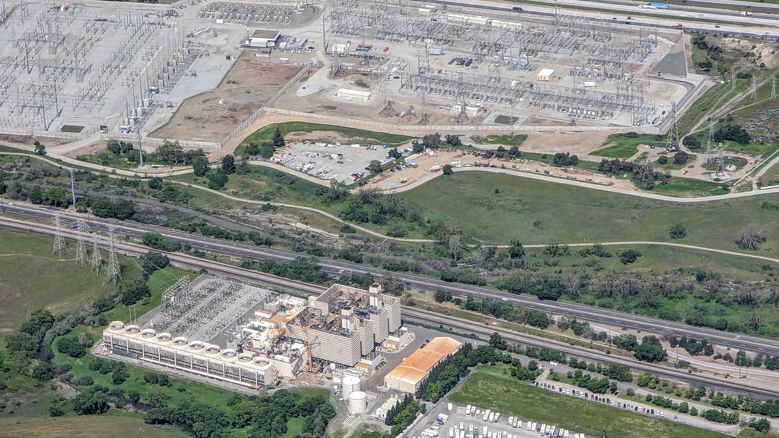 Aerial view of an electrical substation and the corridor of infrastructure around it.